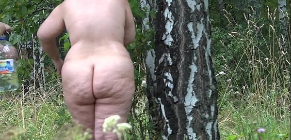  Voyeur spying on lesbians in nature. BBW with a big butt and her slender girlfriend with a hairy cunt wash in a clearing after sexual fun. Amateur fetish.